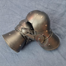 clamshell gauntlets leaning on each other