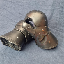 black plastic gauntlets leaning on one another